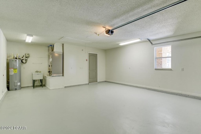 garage featuring heating unit, baseboards, water heater, a sink, and a garage door opener