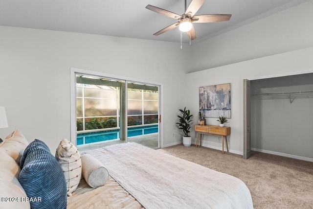 bedroom featuring lofted ceiling, carpet flooring, baseboards, and a closet