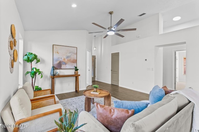 living room with wood finished floors, visible vents, baseboards, recessed lighting, and vaulted ceiling