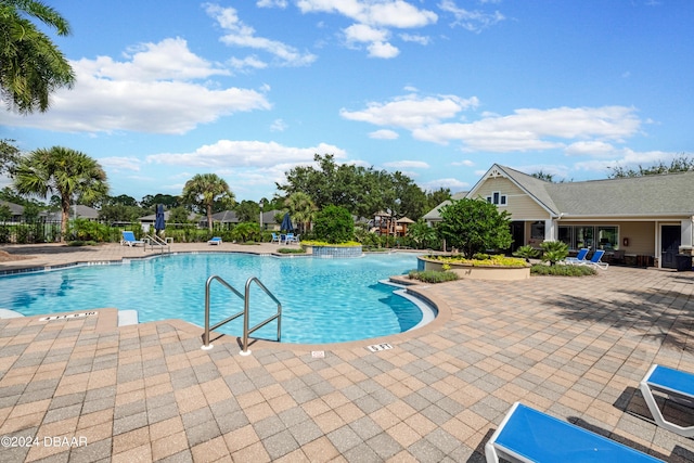 view of swimming pool with a patio area