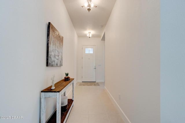 entryway with light tile patterned flooring