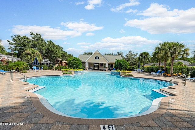 view of swimming pool featuring a patio area