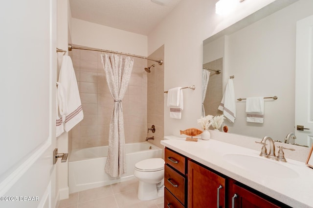 full bathroom featuring shower / bathtub combination with curtain, vanity, a textured ceiling, tile patterned floors, and toilet