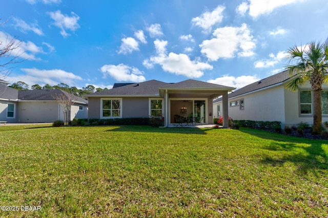 view of front of house with a patio area and a front yard