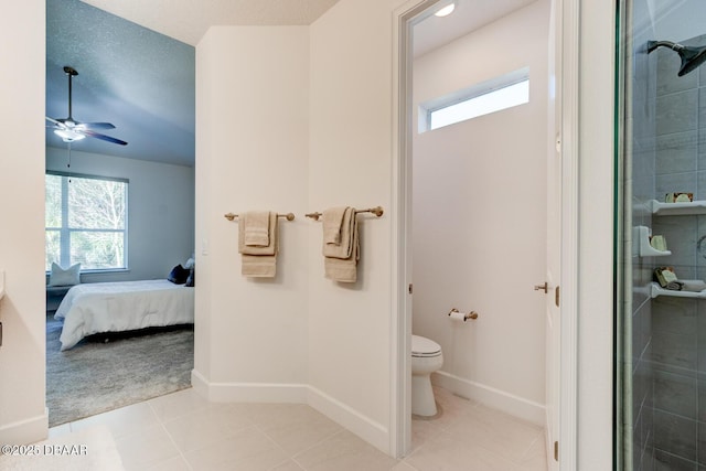 bathroom with a shower with door, ceiling fan, a textured ceiling, tile patterned floors, and toilet