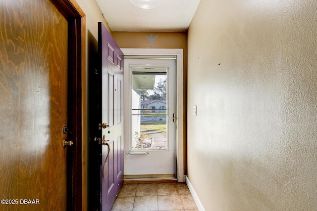 entryway featuring light tile patterned floors