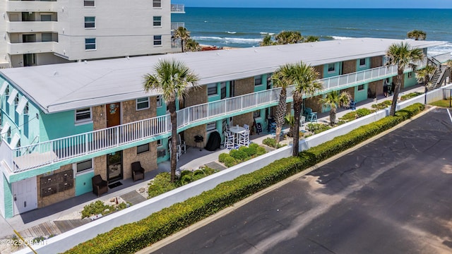 1167 Ocean Shore Blvd Unit 110, Ormond Beach, FL 32176 - view of apartment building / complex featuring view of water and beach