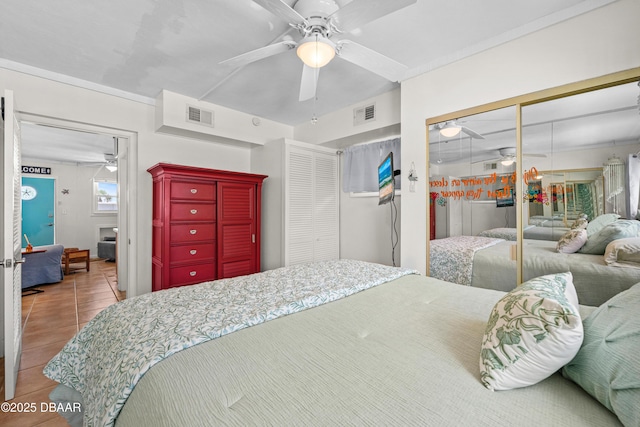 1167 Ocean Shore Blvd Unit 110, Ormond Beach, FL 32176 - bedroom featuring tile patterned floors and a ceiling fan