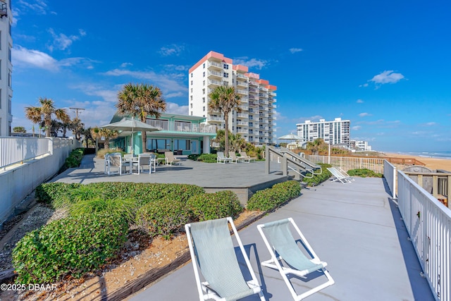 1167 Ocean Shore Blvd Unit 110, Ormond Beach, FL 32176 - view of home's community with a patio area, fence, and a wooden deck