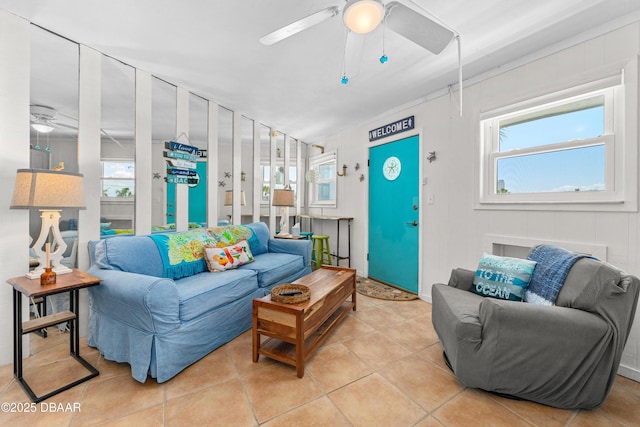 1167 Ocean Shore Blvd Unit 110, Ormond Beach, FL 32176 - living room featuring a ceiling fan, plenty of natural light, and light tile patterned flooring