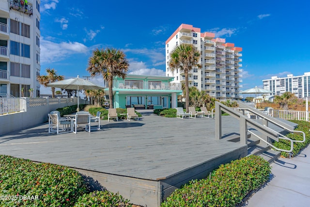 1167 Ocean Shore Blvd Unit 110, Ormond Beach, FL 32176 - view of property's community featuring a wooden deck and fence