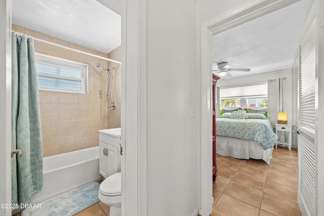 1167 Ocean Shore Blvd Unit 110, Ormond Beach, FL 32176 - ensuite bathroom featuring tile patterned flooring, plenty of natural light, ceiling fan, and toilet