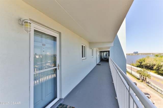 balcony featuring a water view