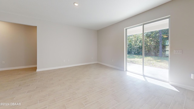 spare room featuring light hardwood / wood-style floors