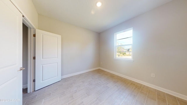 spare room featuring light hardwood / wood-style flooring