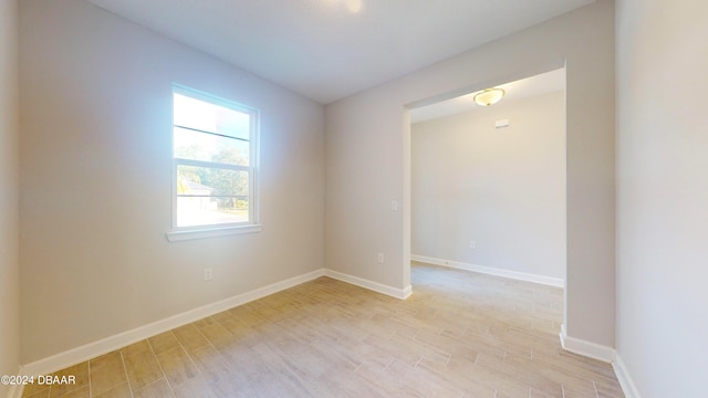 spare room with light hardwood / wood-style floors