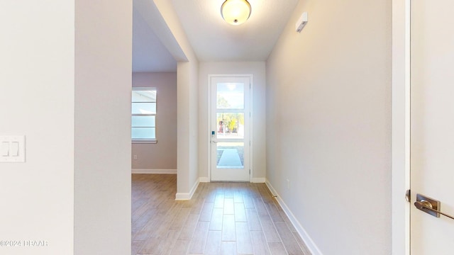 doorway with hardwood / wood-style floors