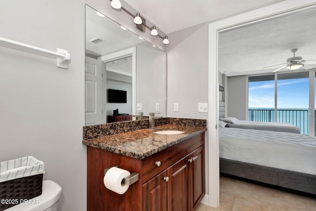 3315 S Atlantic Ave Unit 1606, Daytona Beach Shores, FL 32118 - bathroom with ensuite bathroom, vanity, tile patterned flooring, and a ceiling fan