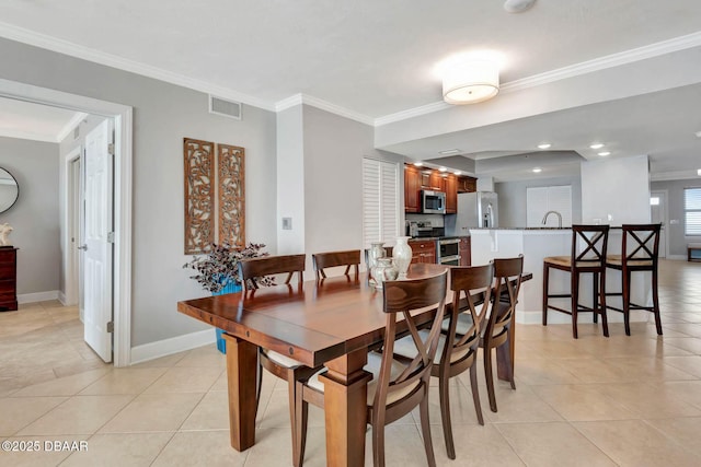 3315 S Atlantic Ave Unit 1606, Daytona Beach Shores, FL 32118 - dining space featuring ornamental molding and light tile patterned floors