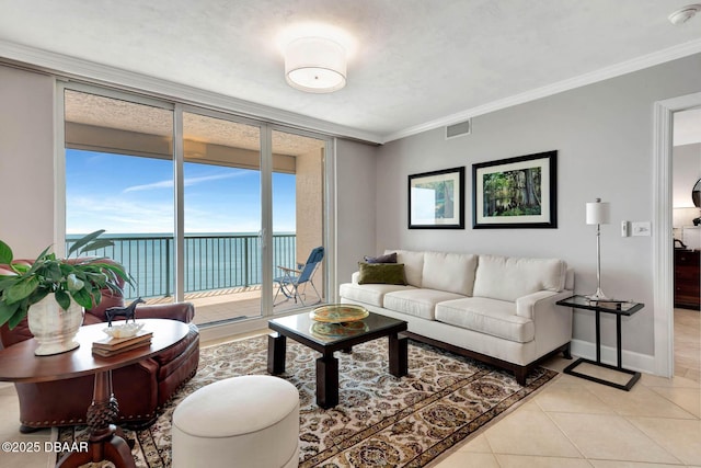3315 S Atlantic Ave Unit 1606, Daytona Beach Shores, FL 32118 - living room featuring a water view, light tile patterned floors, crown molding, and floor to ceiling windows