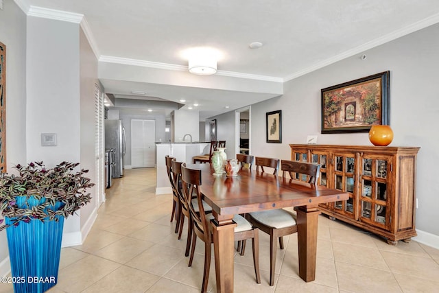 3315 S Atlantic Ave Unit 1606, Daytona Beach Shores, FL 32118 - dining space with light tile patterned floors and ornamental molding
