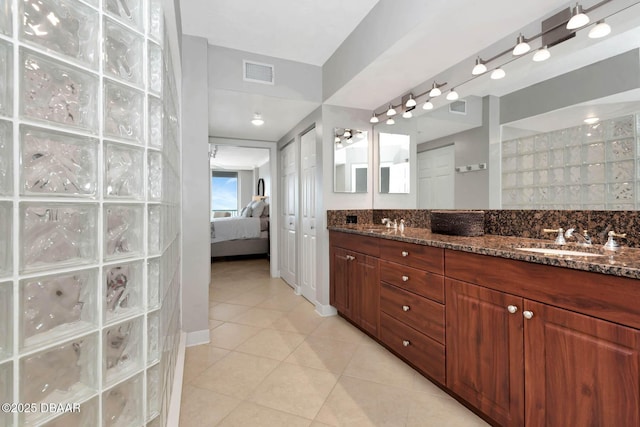 3315 S Atlantic Ave Unit 1606, Daytona Beach Shores, FL 32118 - full bath with double vanity, connected bathroom, tile patterned floors, and a walk in shower