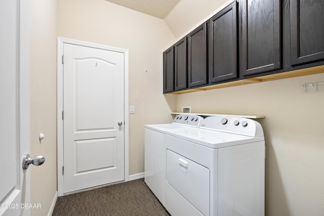 clothes washing area with baseboards, cabinet space, dark carpet, and washing machine and clothes dryer