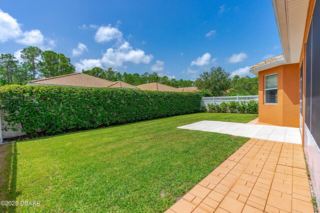 view of yard featuring a patio area and a fenced backyard