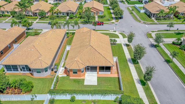 birds eye view of property with a residential view