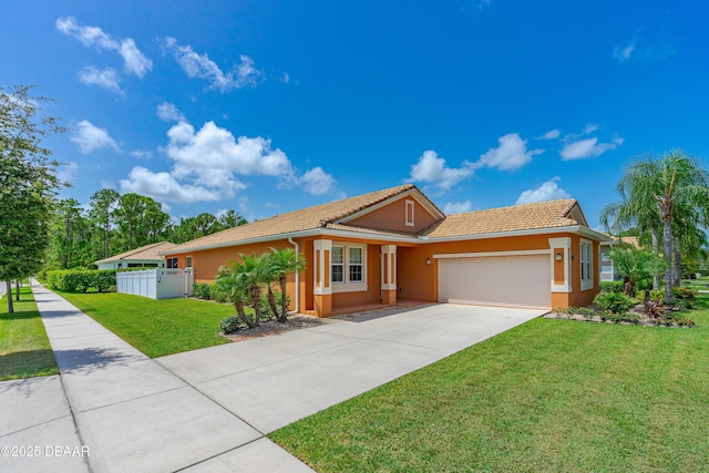 ranch-style house with concrete driveway, stucco siding, an attached garage, fence, and a front yard