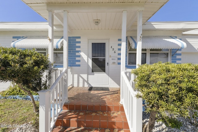 doorway to property with a porch