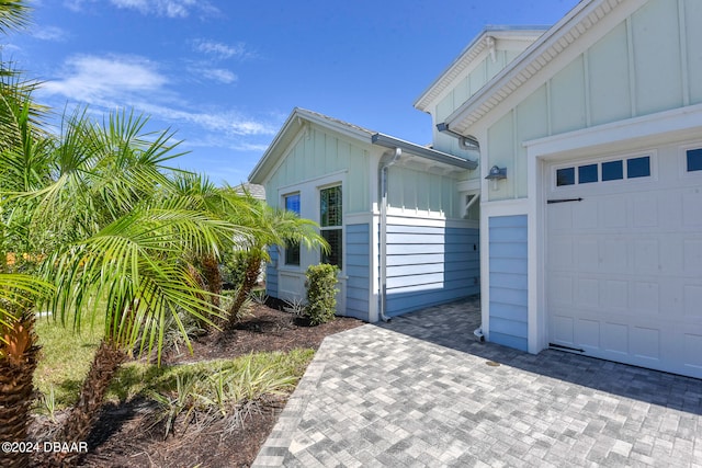 view of side of property featuring a garage