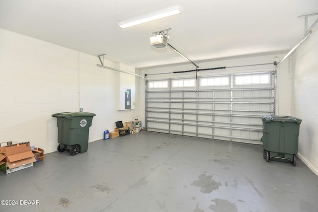 garage with electric panel and a garage door opener