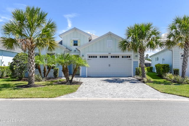 view of front facade featuring a garage and a front lawn