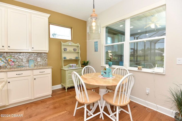 dining area featuring light wood-type flooring