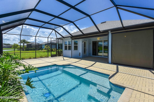 view of pool featuring a patio, a lanai, and a yard