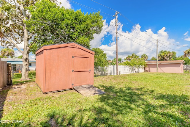 view of outbuilding with a yard