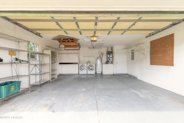 garage with gas water heater, independent washer and dryer, a garage door opener, and heating unit