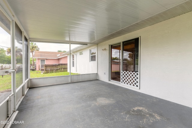 unfurnished sunroom featuring plenty of natural light