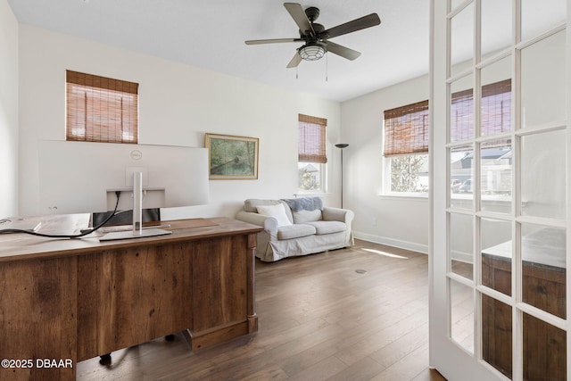 56 Los Lagos Blvd, Palm Coast, FL 32137 - home office featuring wood finished floors, ceiling fan, and baseboards