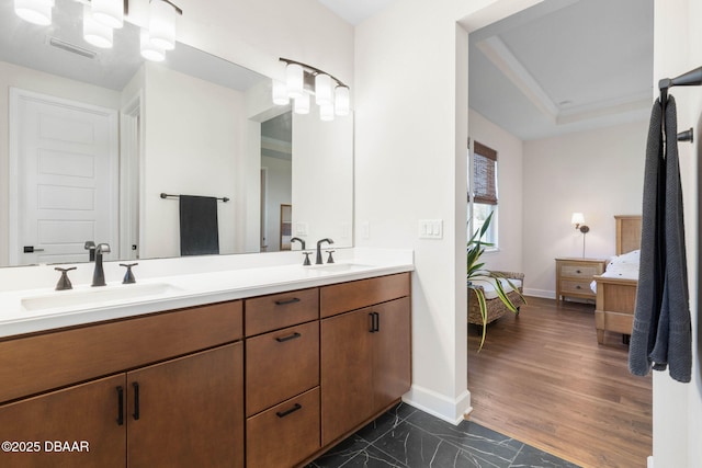 56 Los Lagos Blvd, Palm Coast, FL 32137 - ensuite bathroom with double vanity and baseboards