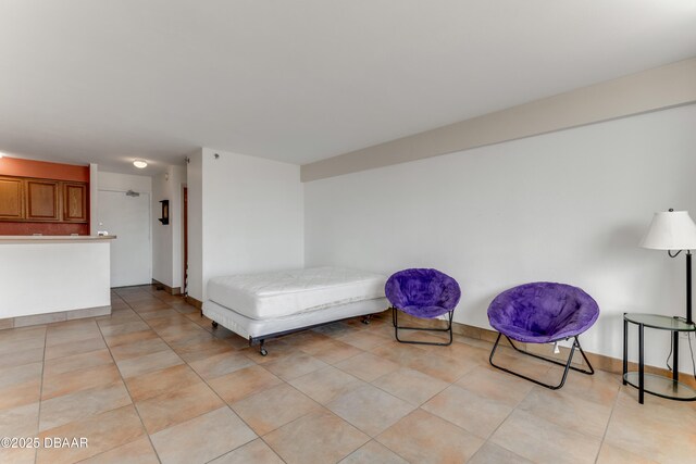 bathroom featuring tile walls, tile patterned floors, shower / bath combination with curtain, and toilet