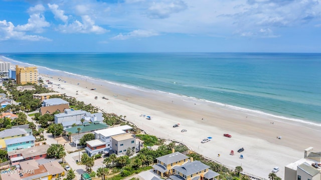 drone / aerial view featuring a view of the beach and a water view