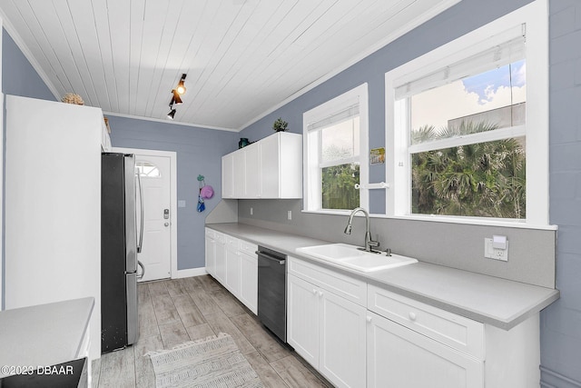 kitchen with stainless steel appliances, wood ceiling, sink, light hardwood / wood-style floors, and white cabinets