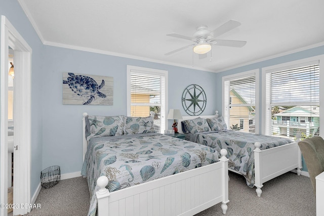 carpeted bedroom featuring ornamental molding and ceiling fan