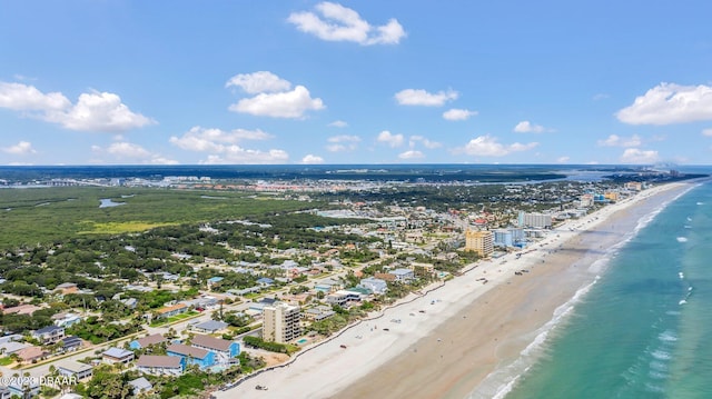 bird's eye view featuring a view of the beach and a water view