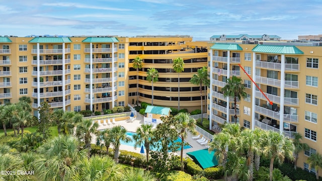 4650 Links Village Dr Unit C402, Ponce Inlet, FL 32127 - view of apartment building / complex featuring a community pool