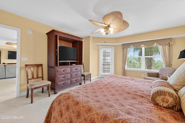 4650 Links Village Dr Unit C402, Ponce Inlet, FL 32127 - carpeted bedroom with a ceiling fan and baseboards