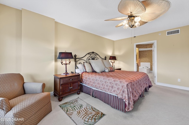 4650 Links Village Dr Unit C402, Ponce Inlet, FL 32127 - bedroom featuring light carpet, ensuite bath, and a ceiling fan