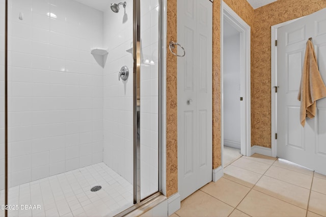4650 Links Village Dr Unit C402, Ponce Inlet, FL 32127 - full bathroom with a stall shower, tile patterned flooring, and wallpapered walls